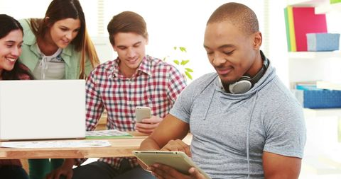 Diverse Young Adults in Tech-Savvy Collaborative Environment - Download Free Stock Images Pikwizard.com