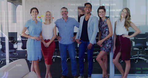 Diverse Business Team Collaboration with Overlaid Financial Graphics