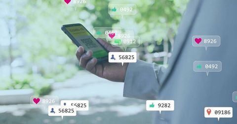 Professional man holding phone with covid-19 qr code outdoors