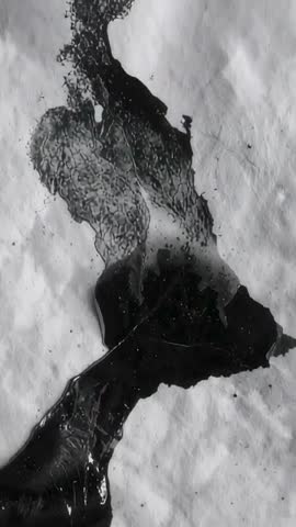 Vertical Video Flowing Black Ink Marbling on Crumpled Paper with Droplets Dark Viscous Texture