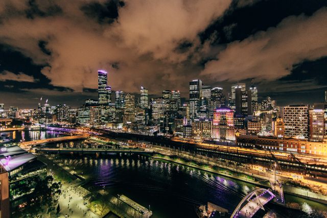 Perfect for websites, brochures, and advertisements related to urban living, travel, or real estate. Ideal for backgrounds, banners, and header images showcasing the beauty and vibrancy of a bustling metropolitan area at night.