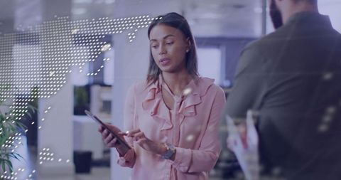 Businesswoman Collaborating with Tablet in Modern Office