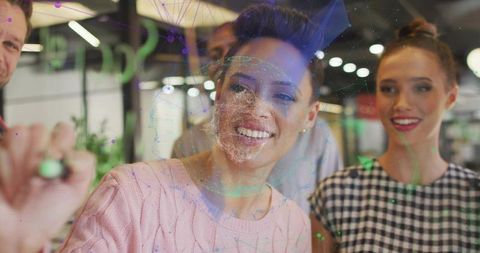 Team collaborates in modern office with holographic projections