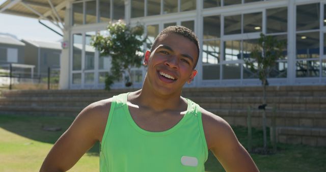 Cheerful Young Athlete Outdoors in Sports Tank Top - Download Free Stock Images Pikwizard.com