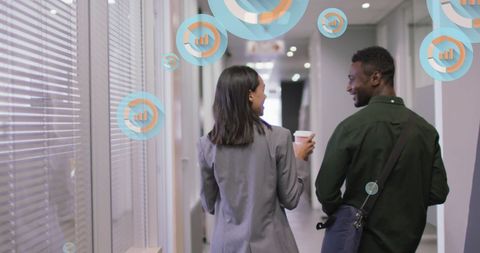 Diverse Businesspeople Discussing Data in Modern Office