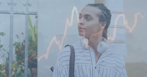 Young Man Comtemplating while Analyzing Rising Stock Trends