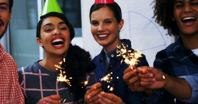 Joyful Office Celebration with Happy Team and Sparklers - Download Free Stock Images Pikwizard.com