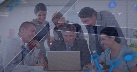 Executive team collaborating around laptop with augmented reality HUD and digital data overlay