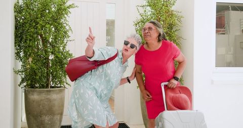 Senior Lesbian Couple Enjoying Vacation Arrival