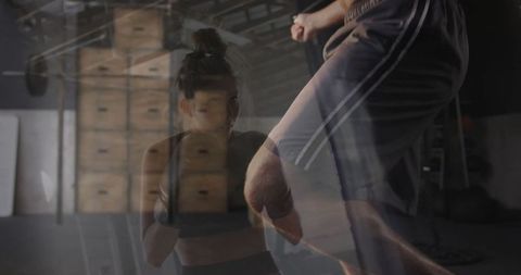 Intense sparring session in industrial boxing gym setting