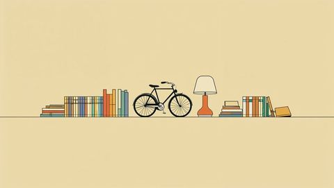Minimalist room interior with bicycle and books