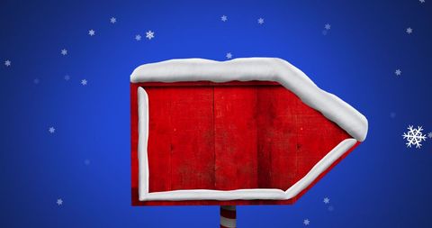 Snow-Covered Red Christmas Sign Against Blue Backdrop