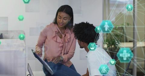 Healthcare Data Collaboration: Woman Pointing at Tablet with Digital Network Analytics