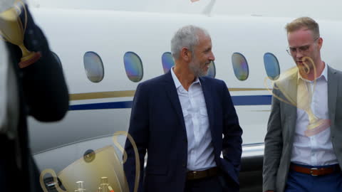 Businessmen Discussing Next to Private Jet