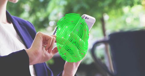 Businesswoman Using Smartphone with Digital Green Fingerprint Overlay