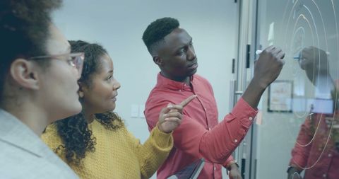 Diverse Business Team Collaborating on Project in Office
