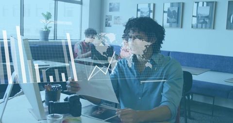 Professional analyzing data in modern collaborative workspace