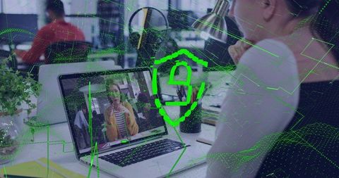 Securing Remote Collaboration with Cybersecurity Shield Overlay on Open Office Laptop