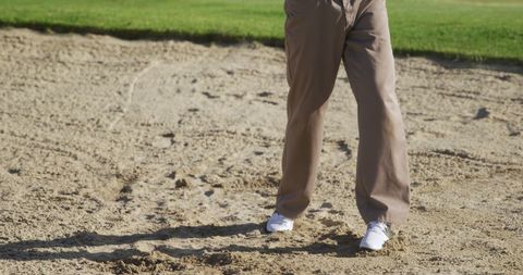 Golfer's Lower Body Stance in Bunker on Golf Course - Download Free Stock Images Pikwizard.com