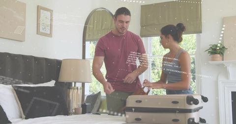 Couple packing weekend suitcase in bright bedroom preparing for vacation and travel plans