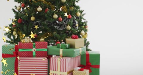Christmas Tree and Presents with Falling Gold Stars - Download Free Stock Images Pikwizard.com