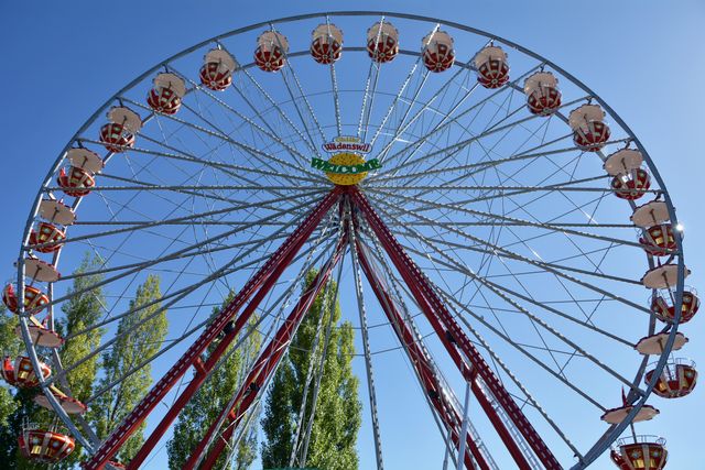 Giant Ferris Wheel in Amusement Park on Clear Day - Download Free Stock Images Pikwizard.com