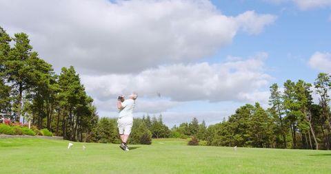 Senior Man Golfing in Peaceful Outdoor Setting