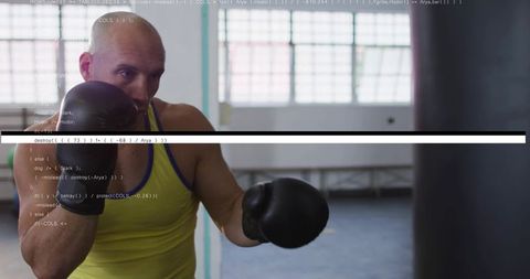 Boxer training with punching bag and code overlay in industrial gym, focused strength