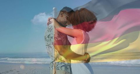 Romantic couple embracing on sunlit beach with german flag overlay double exposure
