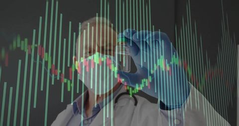 Senior doctor analyzing medical data with graph and vial