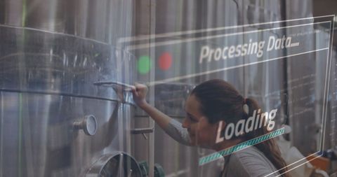 Woman managing data in high-tech industrial facility