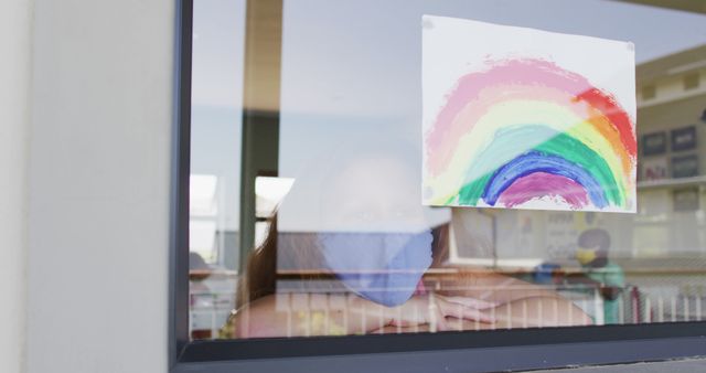 Child with Mask Looking through Window with Colorful Rainbow Painting - Download Free Stock Images Pikwizard.com