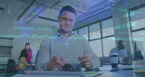 Businessman Analyzing Financial Data on Smartphone Overlaid with Graphs