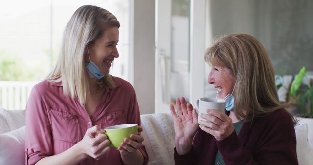 Happy Women with Face Masks Celebrating with Coffee - Download Free Stock Images Pikwizard.com