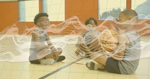 Youthful team gathering in gym with basketball connection