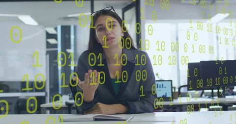 Businesswoman presenting analytics with floating binary code in modern office workspace