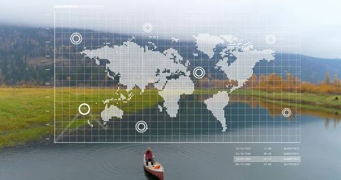 Solo canoeing on misty autumn lake with digital world map overlay for geospatial concept