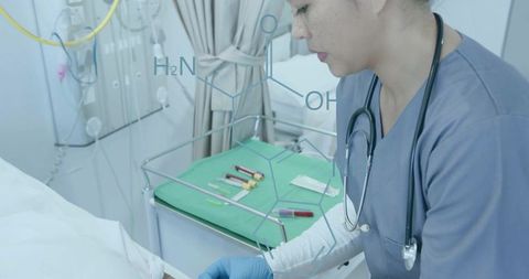 Nurse drawing blood at bedside with stethoscope and phlebotomy equipment