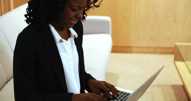 Businesswoman Using Laptop in Office Lounge Area - Download Free Stock Images Pikwizard.com