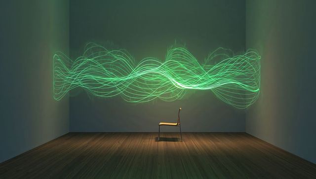Showcasing single chair under spotlight with neon green waveform installation in gallery