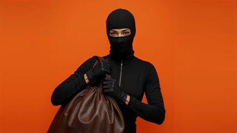 Threatening figure with bag, vibrant background