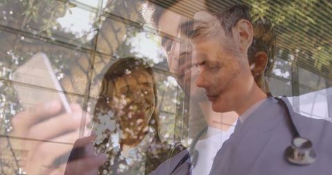 Professional Doctor and Businesswoman Collaborating with Technology