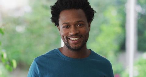 Smiling Biracial Man Enjoying Leisure Time at Home - Download Free Stock Images Pikwizard.com