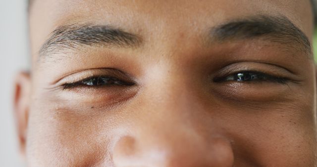 Close-up of smiling man with focus on eyes and eyebrows - Download Free Stock Images Pikwizard.com