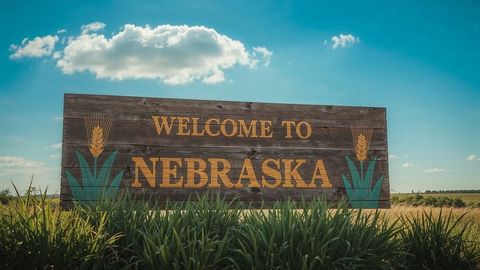 Welcoming Sign Entering Nebraska Among Green Fields