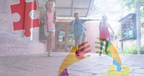 School children running with puzzle ribbon overlay for autism awareness