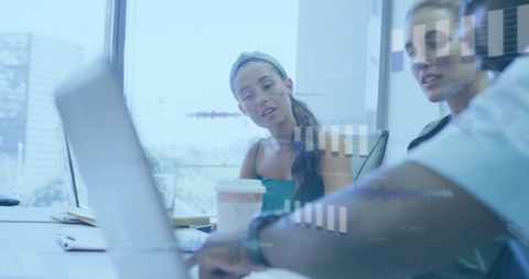 Diverse Business Team Analyzing Financial Data Overlays