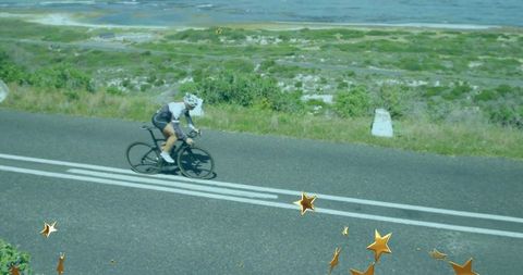 Cyclist enjoying scenic coastal route with aerodynamic focus