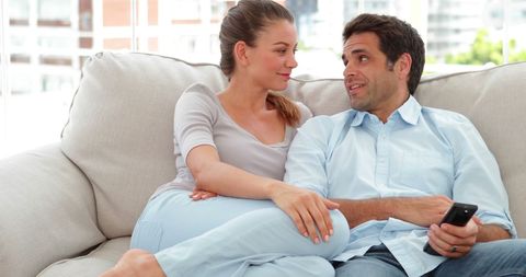 Relaxed Couple Enjoying TV at Home Together