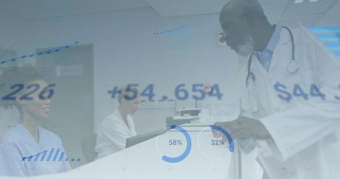 Clinician leaning over desk consulting nursing staff with healthcare analytics overlay